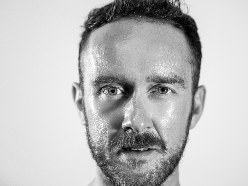 A picture of Paul Smethurst, a white man with a ilght beard looking into the camera