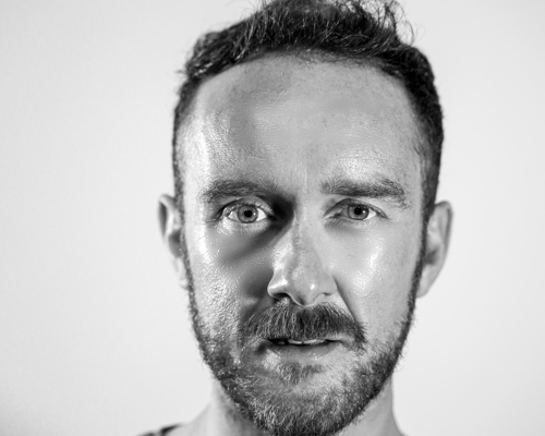 A picture of Paul Smethurst, a white man with a ilght beard looking into the camera