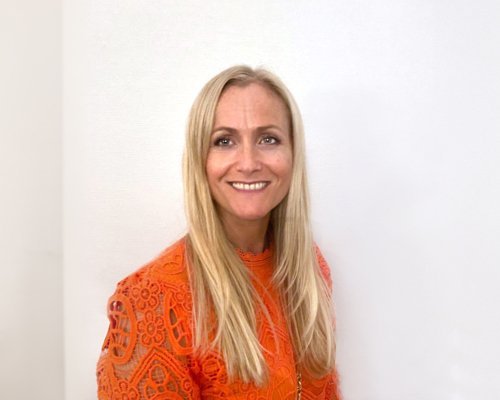 Image of Rebecca Bertram, a blonde woman smiling